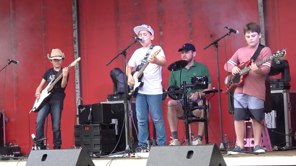 Mr Percival on stage (with drummer) at the 1919 Gayndah Orange Festival.